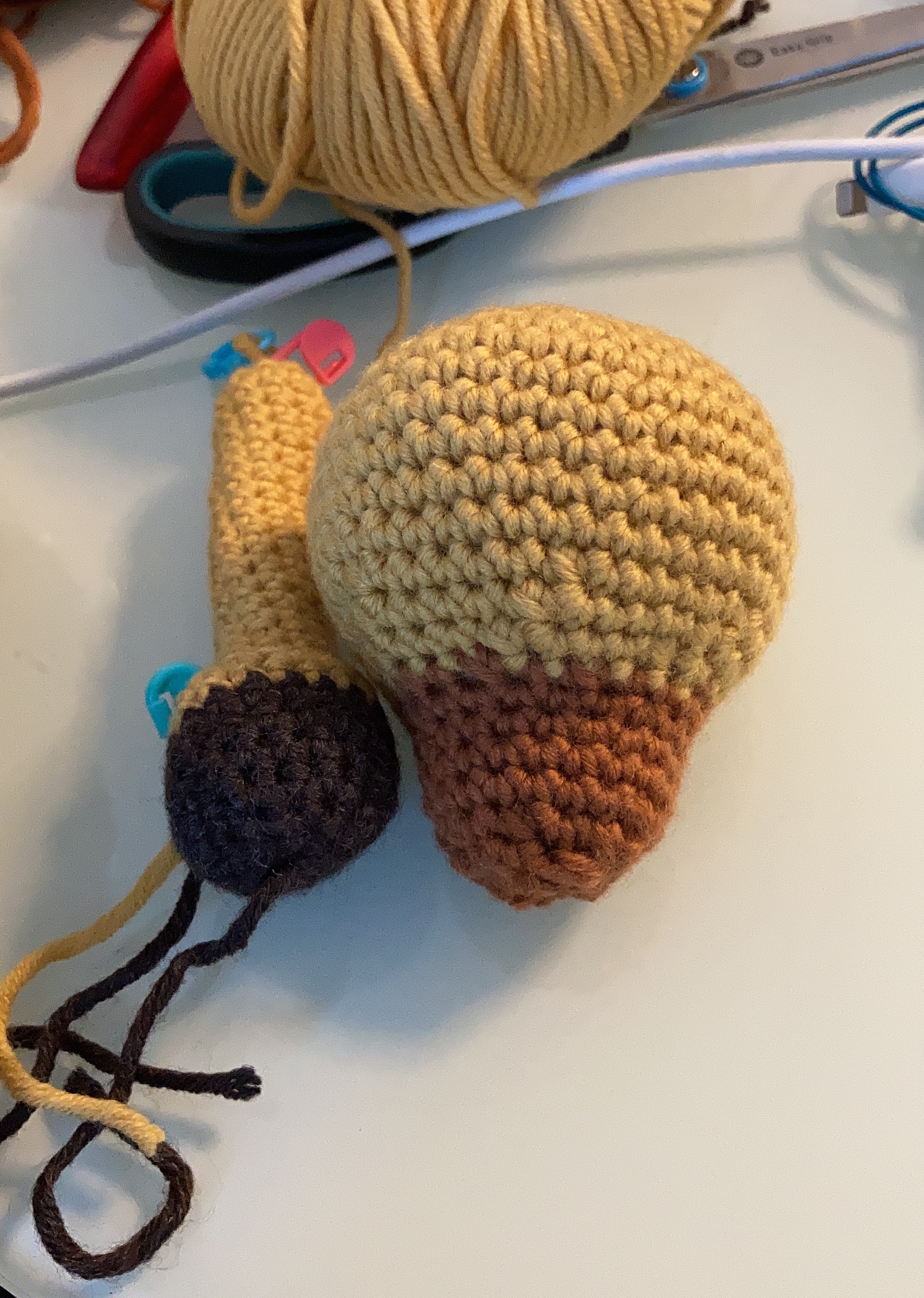 Picture of a giraffe's leg and head, without facial features, technique: crochet